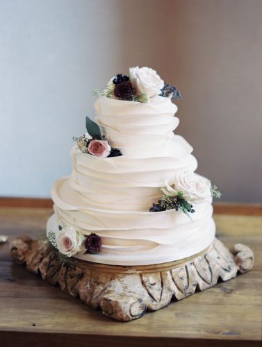 simple-white-white-ruffled-wedding-cake-via-Charity-Maurer